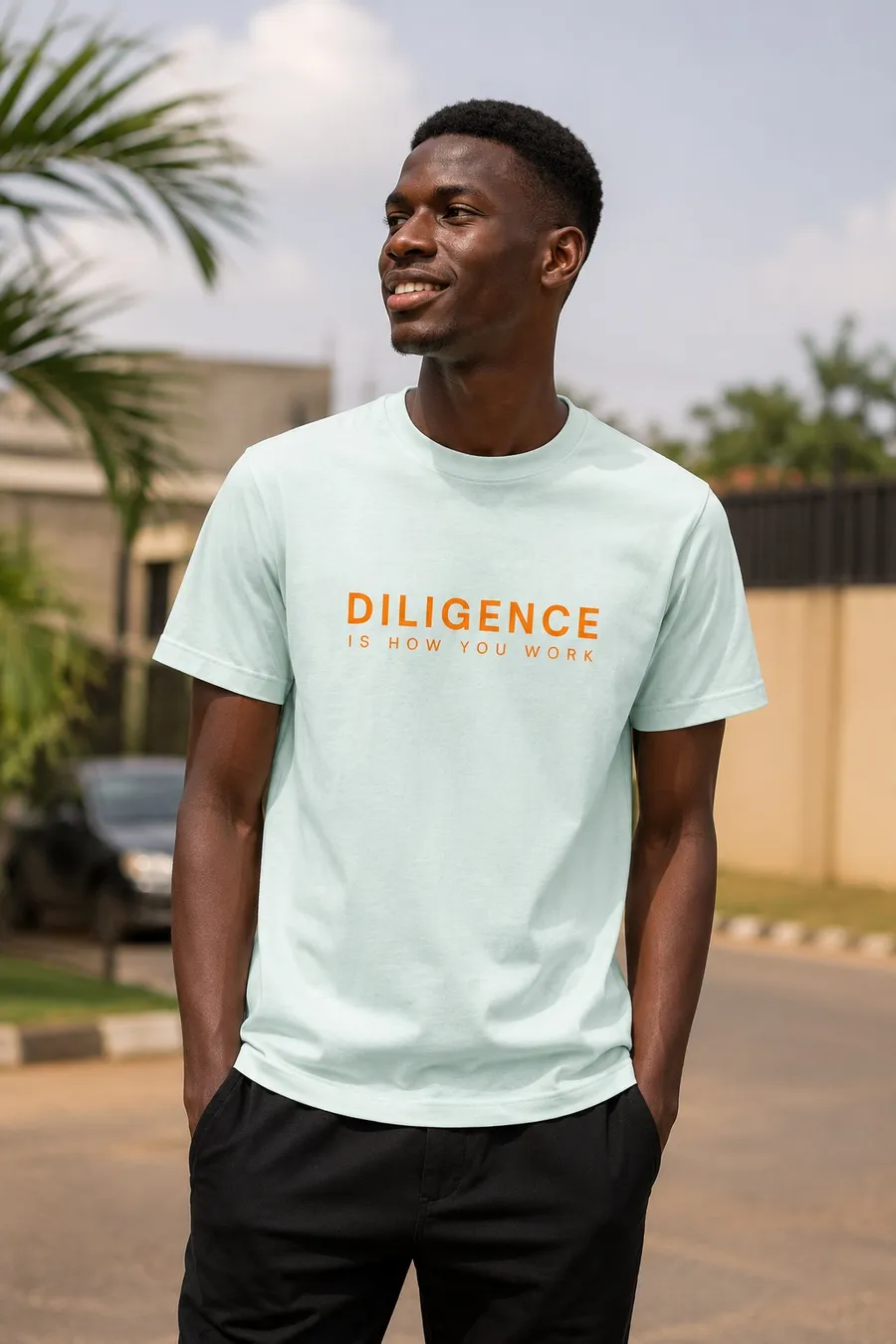 Young man in the mint Diligence tee