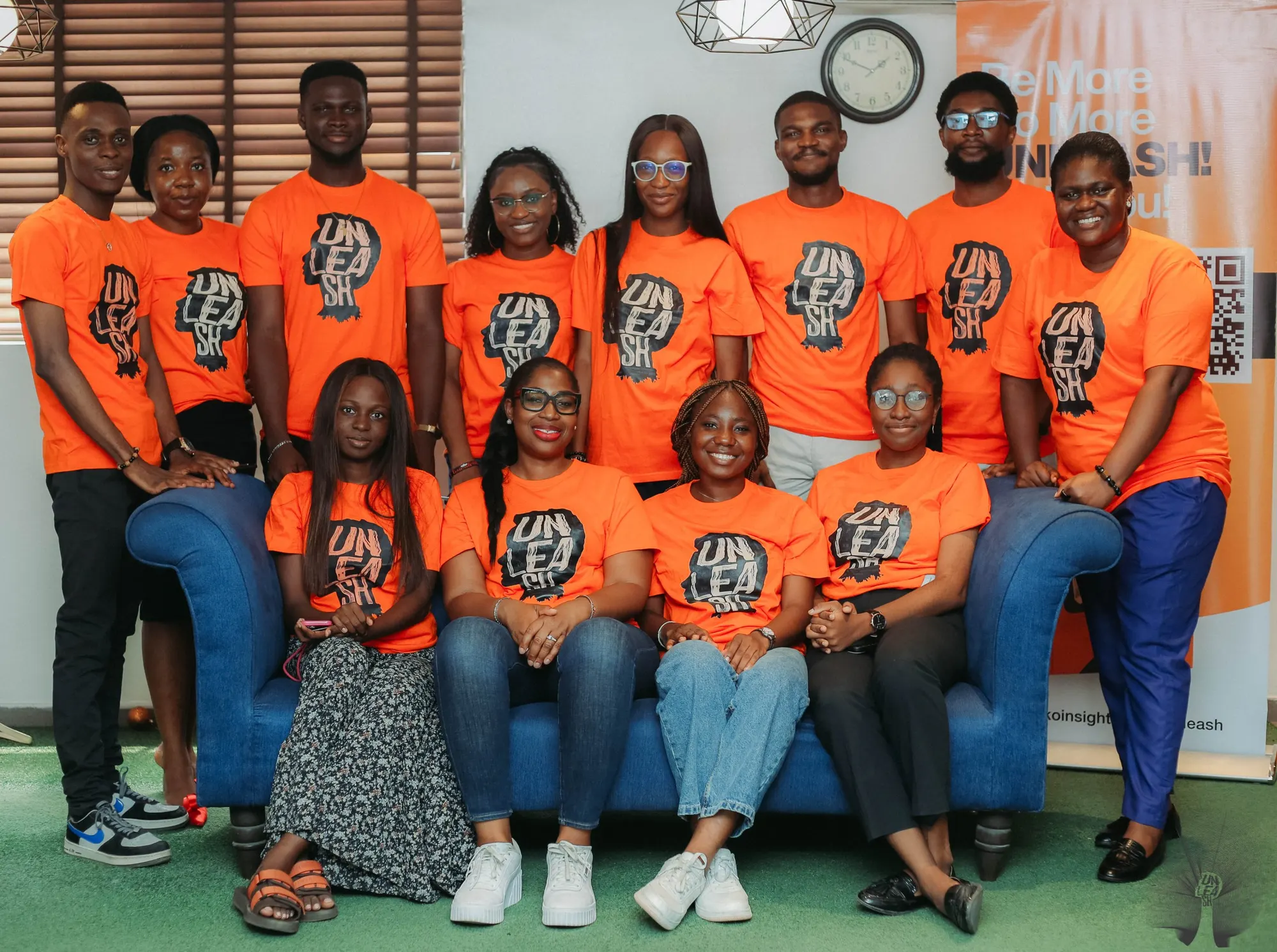 The UNLEASH team in orange UNLEASH t-shirts
